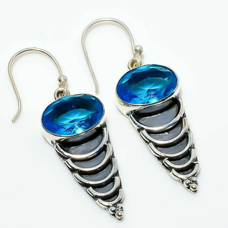 Aσήμι 925 διακοσμημένα με δύο λαμπερά μπλε τοπάζ Aσήμι 925 διακοσμημένα με δύο λαμπερά μπλε τοπάζ