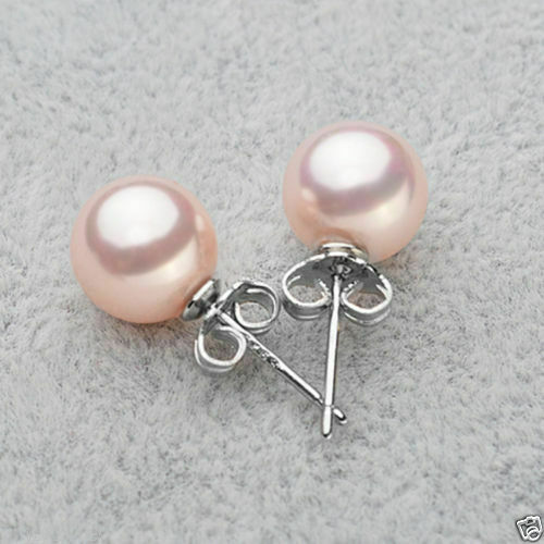 Ασημένια σκουλαρίκια κατασκευασμένα από ασήμι 925 διακοσμημένα με ροζ round south sea shell 10mm. Ασημένια σκουλαρίκια κατασκευασμένα από ασήμι 925 διακοσμημένα με ροζ round south sea shell 10mm.