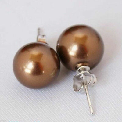 ​Ασημένια σκουλαρίκια κατασκευασμένα από ασήμι 925 διακοσμημένα με καφέ round south sea shell 10mm.​