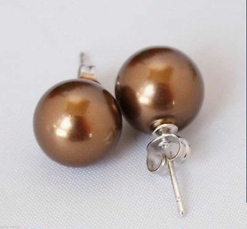 Ασημένια σκουλαρίκια κατασκευασμένα από ασήμι 925 διακοσμημένα με καφέ round south sea shell 10mm. Ασημένια σκουλαρίκια κατασκευασμένα από ασήμι 925 διακοσμημένα με καφέ round south sea shell 10mm.