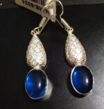 Aσήμι 925 και διακοσμημένα με λαμπερά μπλε τοπάζ